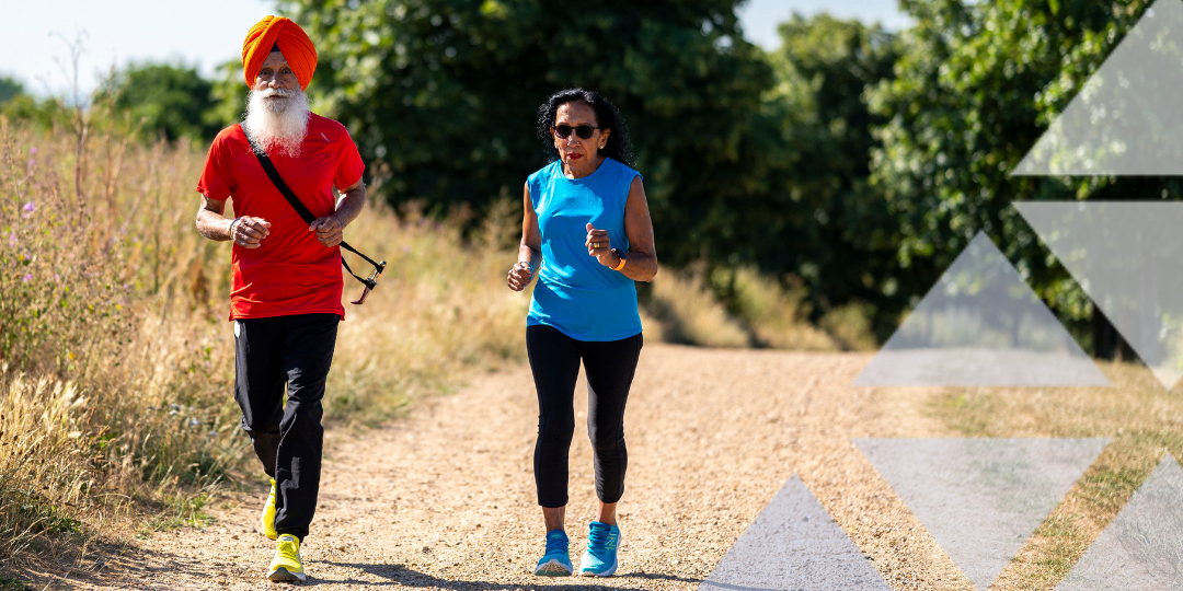 Man and woman running down dirt track